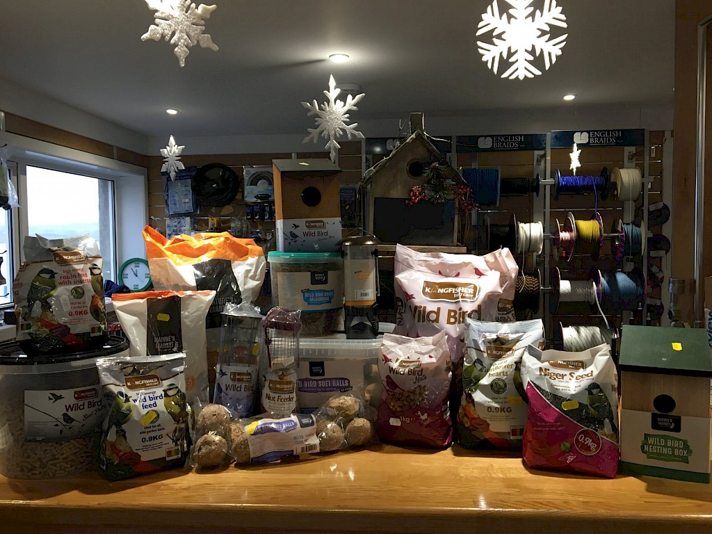 Selection of bird seed and feeding accessories